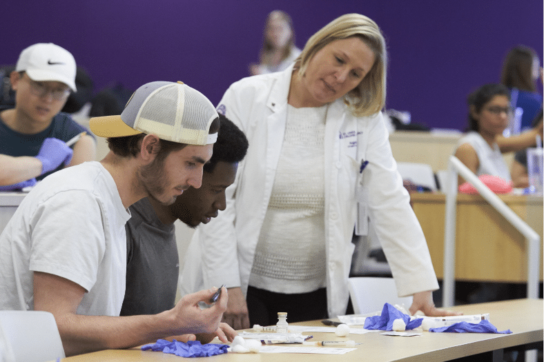 Pharmacy professor mentors two student pharmacists