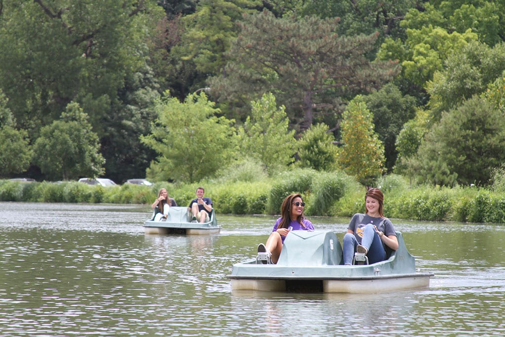 UHSP students use paddle boats at the Boathouse in Forest Park